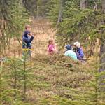 Kids take a break during the 18th Annual Kenai Peninsula Salmon Celebration at Johnson Lake State Recreation Site. Approximately 950 borough students released 5,000 fish into Johnson Lake as part of an Alaska Department of Fish and Game restocking effort. (Photo by Erin Thompson/Peninsula Clarion)