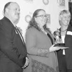 Supt. Sean Dusek and Wendy Lindskoog of BP congratulate Robanne Stading 2018 BP Teacher of the Year.