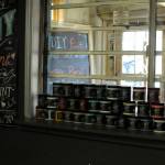 Organic clay-based paint stands stacked in the window at the &ldquo;Art Shack,&rdquo; an art studio space owned by Sue Mann, on Friday, May 4, 2018 in Soldotna, Alaska. Mann, who owns the art supply store Artzy Junkin on the lot next to the Maverick Bar, opened the space as a joint studio space for artists to teach classes or make art. It&rsquo;s been a longtime goal she is starting this year, with classes like a mother and daughter chandelier-making class, mosaic, tie-dye and stained glass. She currently has five artists working on contract, she said. &ldquo;Really, that&rsquo;s my heart for this &mdash; bringing artists together,&rdquo; she said.