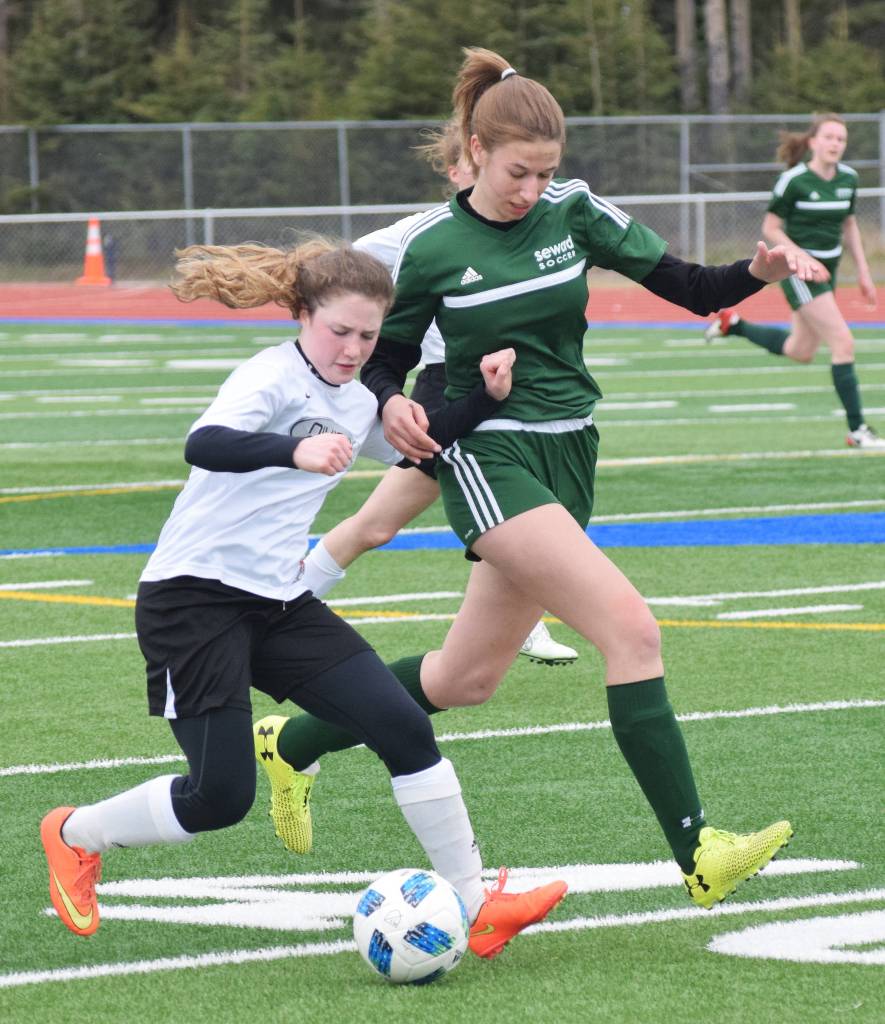 Nikiski&rsquo;s Jordyn Stock (left) battles with Seward&rsquo;s Maddy Moore for the ball Thursday at the Peninsula Conference tournament at Soldotna High School. (Photo by Joey Klecka/Peninsula Clarion)