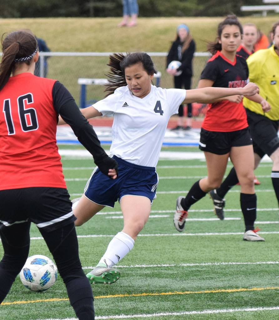 Soldotna freshman Meijan Leaf (4) takes aim at the Kenai Central goal Saturday in the Peninsula Conference girls soccer championship at Soldotna High School. (Photo by Joey Klecka/Peninsula Clarion)