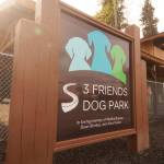 The sign for the 3 Friends Dog Park stands in front of the park&rsquo;s new rain and snow shelter on Monday, May 23, 2018 in Soldotna, Alaska. (Photo by Elizabeth Earl/Peninsula Clarion)