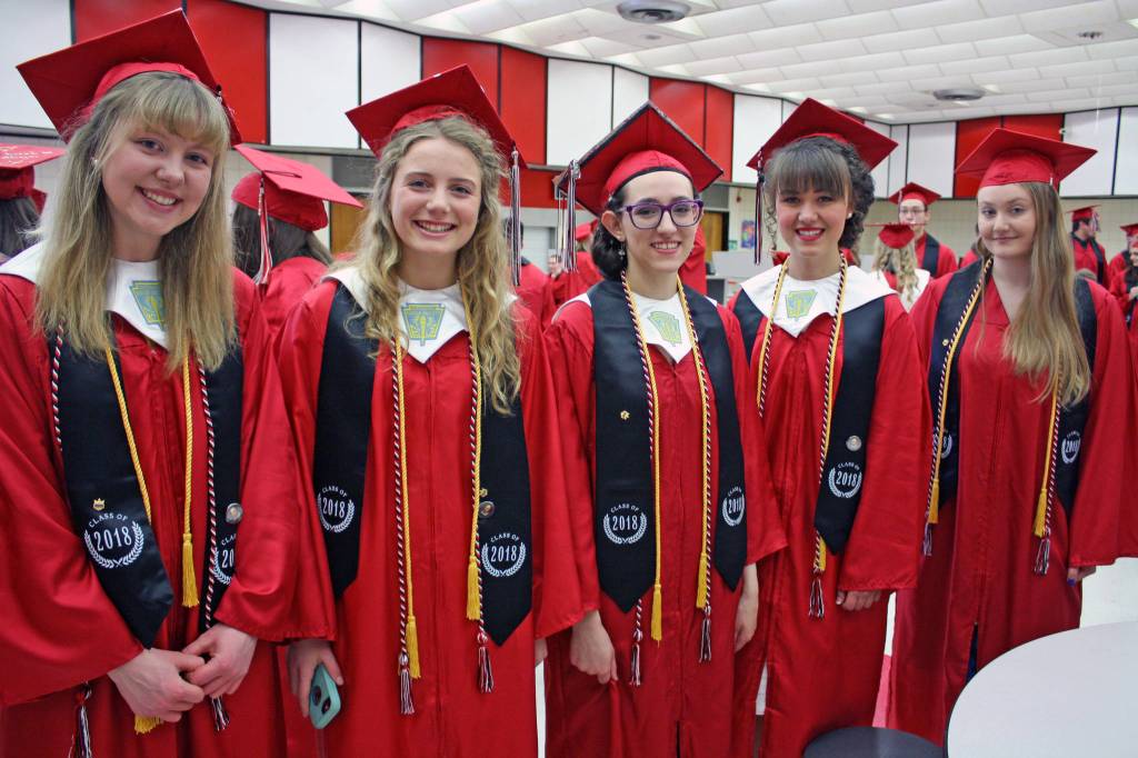 From left, Valedictorians Leah Johnson, Mayzie Potton, Devynn Heath, Natalie Marlowe and Alisa Posey-Schave pose ahead of the 2018 Kenai Central High School graduation on Monday. (Photo by Erin Thompson/Peninsula Clarion)