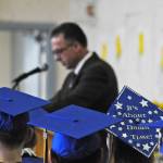 Kenai Alternative High School graduates listen as Principal Loren Reese speaks during their graduation ceremony on Tuesday, May 22, 2018 in Kenai, Alaska. Kenai Alternative High School provides more flexible edcuation for students who struggled in traditional high school environments, scheduling classes around jobs, children and life circumstances to help students achieve their high school diplomas. (Photo by Elizabeth Earl/Peninsula Clarion)