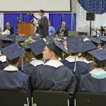 A graduate listens to a musical performance during the Soldotna High School commencement at the Soldotna Sports Complex on Tuesday. (Photo by Erin Thompson/Peninsula Clarion)