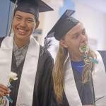 Graduate Henry Heft, left, jokes with a friend ahead of the 2018 commencement ceremony at Nikiski High School on Wednesday. Heft will begin a five-year stint in the U.S. Army in June. (Photo by Erin Thompson/Peninsula Clarion)