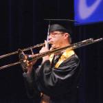 Connections Homeschool graduate Eli Stoll plays the trombone during a student performance at the program&rsquo;s graduation ceremony on Thursday, May 24, 2018 in Soldotna, Alaska. The program, administered by the Kenai Peninsula Borough School District, graduated 58 students this year. (Photo by Elizabeth Earl/Peninsula Clarion)