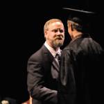 Connections Homeschool Principal Richard Bartolowitz shakes a graduate&rsquo;s hand at the program&rsquo;s graduation ceremony on Thursday, May 24, 2018 in Soldotna, Alaska. The program, administered by the Kenai Peninsula Borough School District, graduated 58 students this year. (Photo by Elizabeth Earl/Peninsula Clarion)