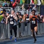 Soldotna&rsquo;s Brenner Furlong (left) sprints to the finish line of the Division I boys 200-meter dash Saturday afternoon at the Alaska Track and Field state championship meet at Palmer High School. (Photo by Joey Klecka/Peninsula Clarion)