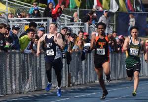 Soldotna&rsquo;s Brenner Furlong (left) sprints to the finish line of the Division I boys 200-meter dash Saturday afternoon at the Alaska Track and Field state championship meet at Palmer High School. (Photo by Joey Klecka/Peninsula Clarion)