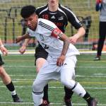 Kenai&rsquo;s Kevin Ramos blocks out Juneau&rsquo;s Clem Taylor-Roth from the ball in the Division II state soccer championship final Saturday afternoon at Service High School. (Photo by Joey Klecka/Peninsula Clarion)