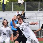 Kenai&rsquo;s Titus Riddall (15) puts a head on the ball in the Division II state soccer championship final against Juneau-Douglas Saturday afternoon at Service High School. (Photo by Joey Klecka/Peninsula Clarion)
