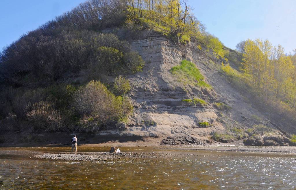 An angler tosses a line in the water near the mouth of Deep Creek on Sunday, May 28, 2018 in Ninilchik, Alaska. Despite the perfect weather and holiday weekend, few anglers dotted the banks of the Ninlichik River and Deep Creek on Sunday, in part because the number of salmon in the rivers so far is still fairly paltry. The Alaska Department of Fish and Game classified the fishing over Memorial Day weekend as poor, in part because the water temperatures are still chilly for this time of year. (Photo by Elizabeth Earl/Peninsula Clarion)