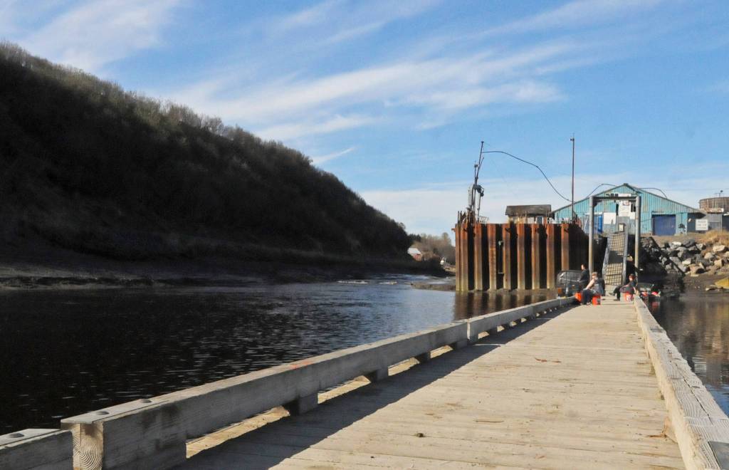 Patient anglers wait for a bite near the mouth of Ninilchik River on Sunday, May 28, 2018 in Ninilchik, Alaska. Despite the perfect weather and holiday weekend, few anglers dotted the banks of the Ninlichik River and Deep Creek on Sunday, in part because the number of salmon in the rivers so far is still fairly paltry. The Alaska Department of Fish and Game classified the fishing over Memorial Day weekend as poor, in part because the water temperatures are still chilly for this time of year. (Photo by Elizabeth Earl/Peninsula Clarion)