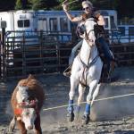 Corey Wilkinson lassoes a cow Friday during events at the PCRS Rodeo at the Soldotna Rodeo Grounds. (Photo by Joey Klecka/Peninsula Clarion)