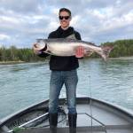 Jesse Rogde holds the 34-inch Kenai River king salmon he caught on Memorial Day on the lower Kenai River. (Photo courtesy Scott Miller)