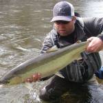Mark Hieronymus poses with a steelhead caught in 2014 on a Southeast Alaska river. (Photo by Tyson Fick)