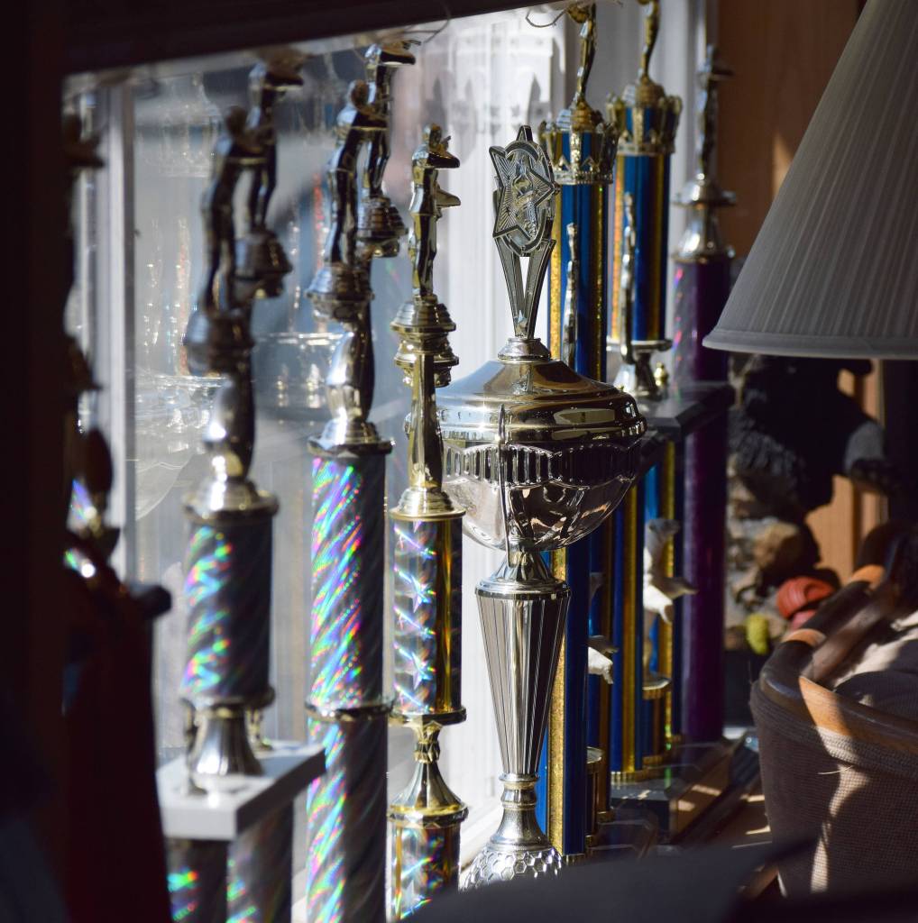 Trophies line the wall and window sill of the Snowshoe Gun Club June 2 at a scholastic clay shooting event in Kenai. (Photo by Joey Klecka/Peninsula Clarion)