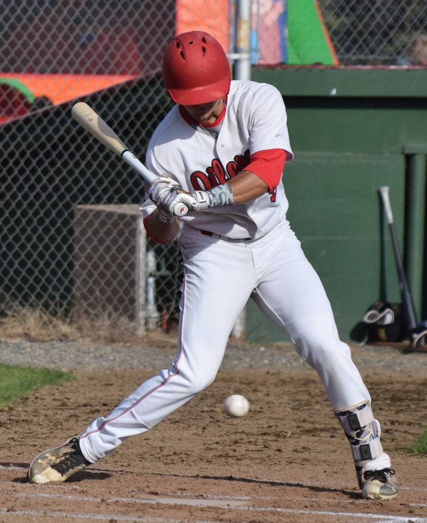 Peninsula Oilers batter Tyler Duke holds on a pitch against Anchorage Bucs starter Preston Price, Friday evening at Coral Seymour Memorial Ballpark in Kenai. (Photo by Joey Klecka/Peninsula Clarion)