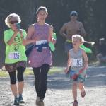 Emily (left) and Hadley Kornelis approach the finish of the women&rsquo;s 5K race Saturday morning at the Run for the River 5K/10-mile races near Soldotna Creek Park. (Photo by Joey Klecka/Peninsula Clarion)