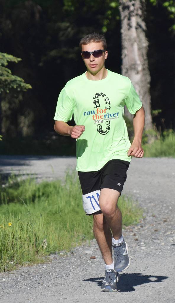 Bradley Walters takes an early lead Saturday morning at the Run for the River 5K/10-mile races near Soldotna Creek Park. (Photo by Joey Klecka/Peninsula Clarion)