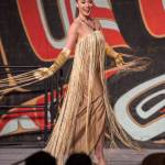 Former Miss Alaska USA Alyssa London displays designers Jason Brown and Donna Decontie-Brown&rsquo;s work at the Native Fashion Show at Centennial Hall on Friday, June 8, 2018. (Michael Penn | Juneau Empire)