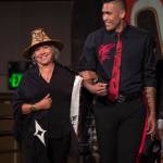 Model Damen Bell-Holter escorts designer Dorothy Grant across the stage at the Native Fashion Show at Centennial Hall on Friday, June 8, 2018. (Michael Penn | Juneau Empire)