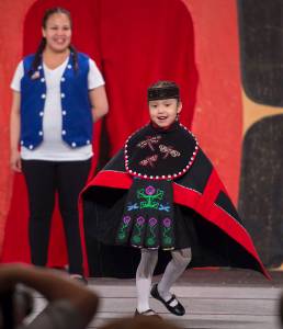 McKayla Paul participates with her mother in the Toddler Fashion Show on the main stage at Centennial Hall for Celebration 2018 on Friday, June 8, 2018. (Michael Penn | Juneau Empire)