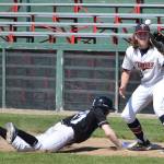 Kenai Twins first baseman Logan Smith catches a pickoff attempt from Twins pitcher Adam Brinster with Chugiak&rsquo;s Austin Bull on the bases Wednesday afternoon at Coral Seymour Memorial Ballpark. (Photo by Joey Klecka/Peninsula Clarion)