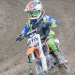 Kash Williams, of Soldotna, negotiates a turn in the 50cc race at the Alaska State Motocross Championships at Twin City Raceway on Sunday, June 17, 2018. (Photo by Jeff Helminiak/Peninsula Clarion)