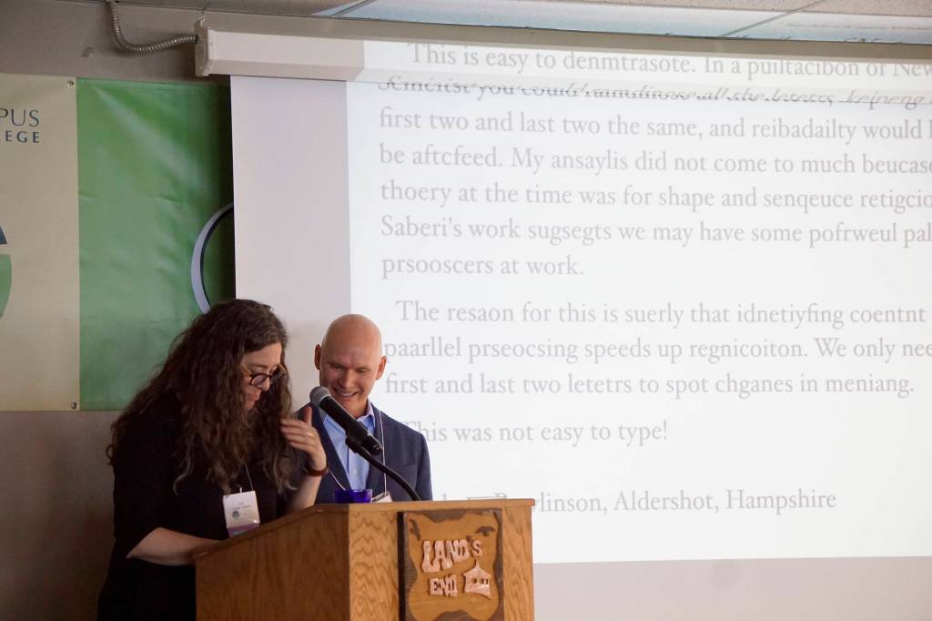 Homer poet and Kachemak Bay Writers&rsquo; Conference faculty member Erin Coughlin Holliwell, left, reads a passage that shows words can be understood even when the letters are garbled as keynote speaker Anthony Doerr watches. Doerr delivered the opening address at the start of the annual conference last Friday, June 5, at Land&rsquo;s End Resort. (Photo by Michael Armstrong/Homer News)