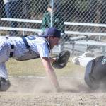 Soldotna catcher Cody Quelland (left) tags out Colony&rsquo;s Zach Satterly in a Southcentral Conference contest May 9, 2017, at the Soldotna baseball fields. (Photo by Joey Klecka/Peninsula Clarion)
