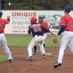 Danny Dopp of the Chugiak-Eagle River Chinooks tosses to Gregory Ozuna to retirie Oilers&rsquo; Brian Leonhardt in a rundown Thursday, June 21, 2018, at Coral Seymour Memorial Park in Kenai. (Photo by Jeff Helminiak/Peninsula Clarion)
