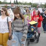 Participants in the Two Spirit Pride March walk along the Sterling Highway on their way to Soldotna Creek Park Wednesday. About 60 people turned out to the march celebrating LGBTQ Pride. (Photo by Erin Thompson/Peninsula Clarion)