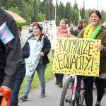 Participants in the Two Spirit Pride March walk along the Kalifornsky Beach Road on their way to Soldotna Creek Park Wednesday. About 60 people turned out to celebrate LGBTQ Pride. (Photo by Erin Thompson/Peninsula Clarion)