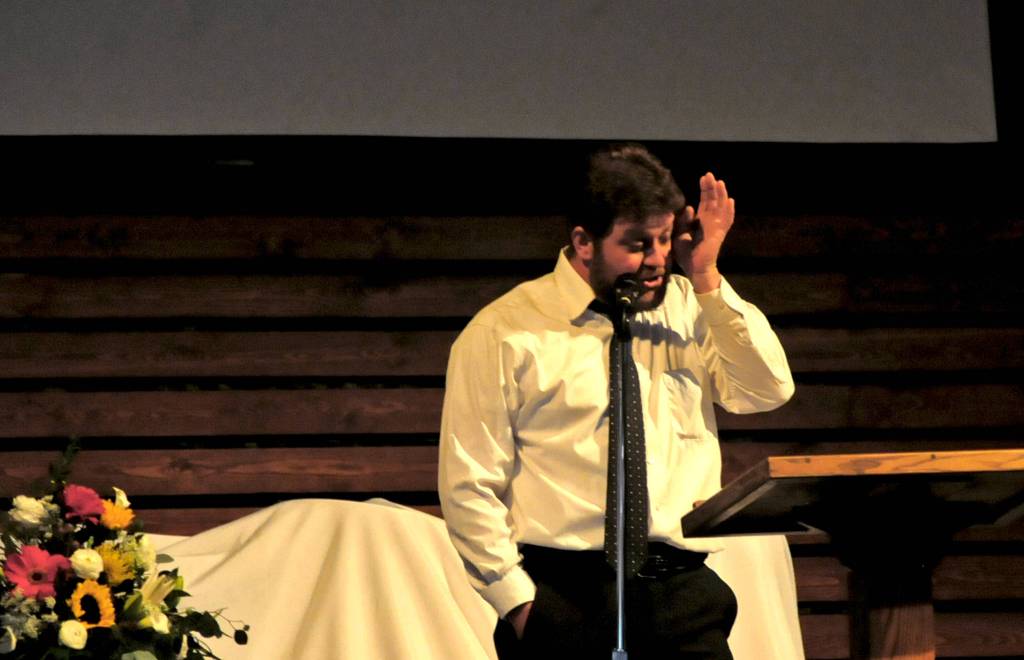 Criss Adams wipes his eyes while giving a eulogy for Travis Stubblefield at Peninsula Grace Brethren Church on Saturday, June 30, 2018 near Soldotna, Alaska. Stubblefield, a lifelong resident of the Soldotna area, was killed June 21 in a conflict in Kasilof. Alaska State Troopers are investigating the circumstances of his death, though no charges have yet been filed. (Photo by Elizabeth Earl/Peninsula Clarion)