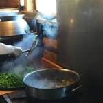 Residents take turns cooking for the community in the large kitchen inside the Ionian Community Center on Tuesday, July 3, near Kasilof, Alaska. (Photo by Victoria Petersen/Peninsula Clarion)