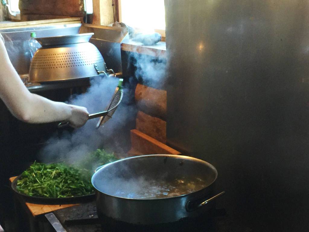Residents take turns cooking for the community in the large kitchen inside the Ionian Community Center on Tuesday, July 3, near Kasilof, Alaska. (Photo by Victoria Petersen/Peninsula Clarion)