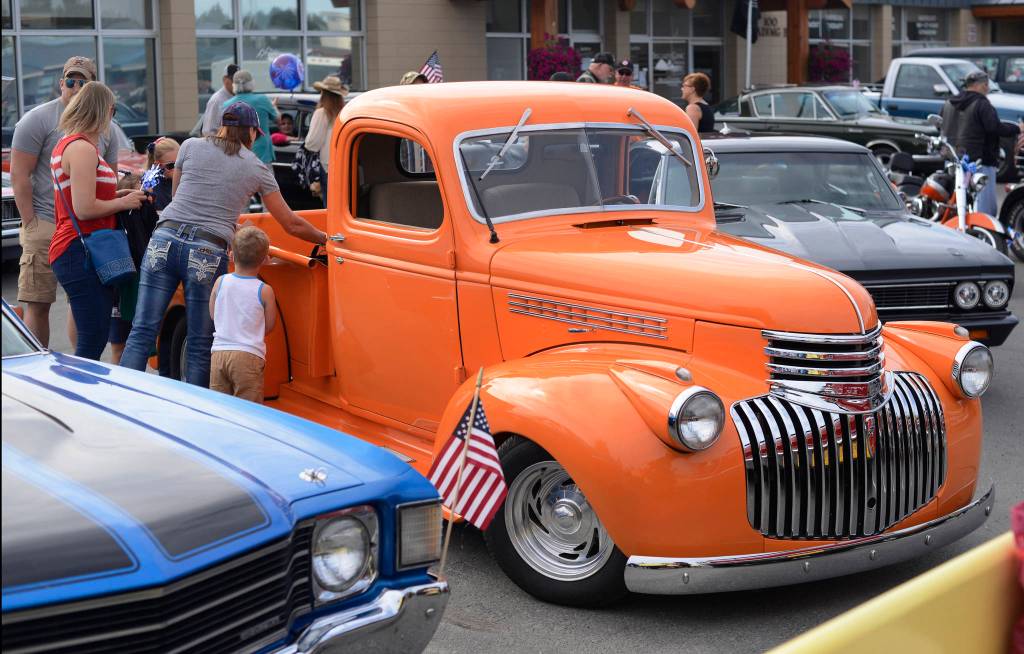 Vintage vehicles owned by members of the Kaknu Kruzers Car Club gather before Kenai&rsquo;s Fourth of July parade on Wednesday, July 4, 2018 in Kenai, Alaska. (Ben Boettger/Peninsula Clarion)