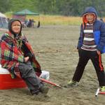 Dipnetters wade into the Cook Inlet in hopes of catching salmon on the first day of dipnetting season on Tuesday, July 10, 2018, in Kenai, Alaska. (Photo by Erin Thompson/Peninsula Clarion)