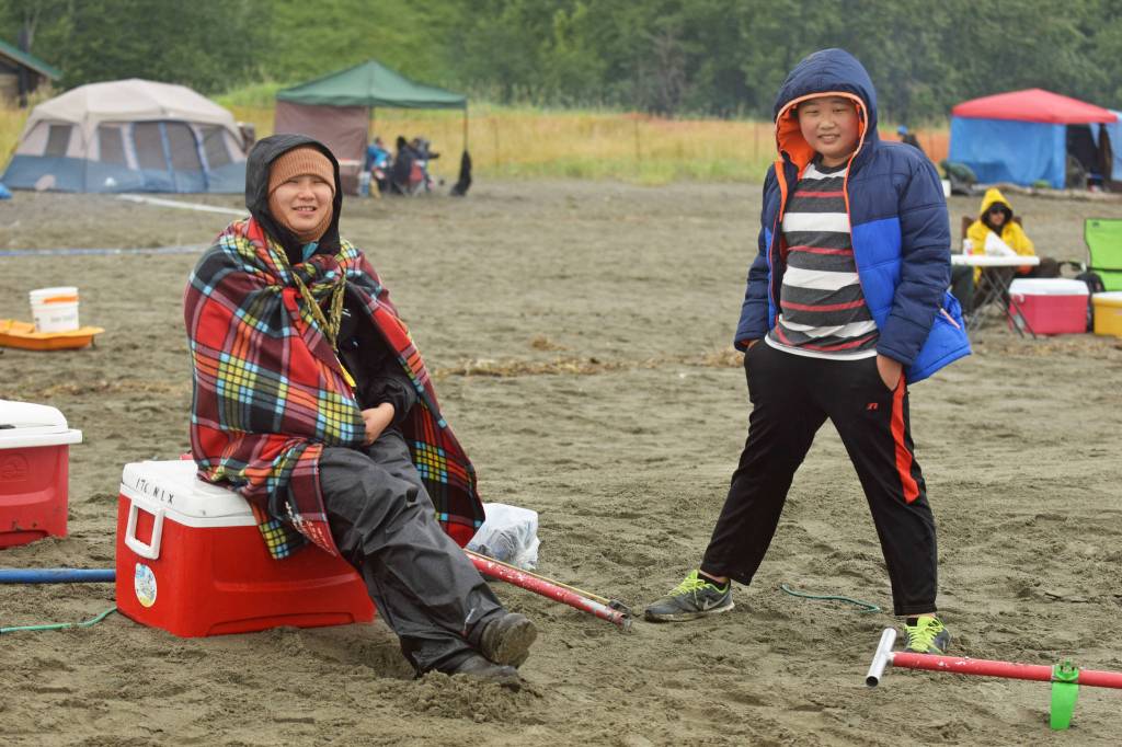 Dipnetters wade into the Cook Inlet in hopes of catching salmon on the first day of dipnetting season on Tuesday, July 10, 2018, in Kenai, Alaska. (Photo by Erin Thompson/Peninsula Clarion)