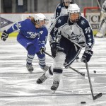 Soldotna&rsquo;s Corey Hanson moves the puck up the ice Friday, Jan. 13, 2017, against Palmer at the Soldotna Regional Sports Complex. (Photo by Jeff Helminiak/Peninsula Clarion)