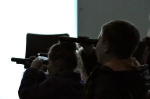 Kids learned the basics of visible and invisible light during a presentation from the Challenger Learning Center of Alaska on Monday, Jan. 16, 2017 at the Soldotna Public Library in Soldotna, Alaska. There wasn&rsquo;t much sunlight, but the kids attending the event heard about the electromagnetic spectrum and learned how to use a spectrometer to see the types of light in the world around them. Summer Lazenby, the director of educational operations at the Challenger Learning Center, brought filters and spectrometers for the kids to see firsthand how light moves and is split into its different components of color.