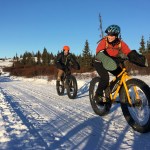 Angie Brennan and Sean Dunham pedal fat-tire bikes in the Caribou Hills near Ninilchik on Jan. 8, 2017. (Photo by Will Morrow/Peninsula Clarion)