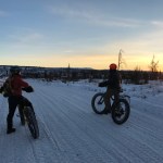 Angie Brennan and Mike Crawford pause to take in the sunrise in the Caribou Hills near Ninilchik on Jan. 8, 2017. (Photo by Will Morrow/Peninsula Clarion)