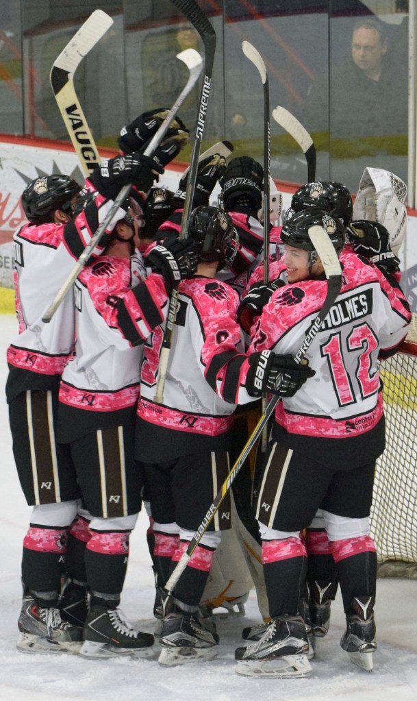 The Kenai River Brown Bears celebrate a victory over the Aston (Pennsylvania) Rebels on Friday at the Soldotna Regional Sports Complex. (Photo by Jeff Helminiak/Peninsula Clarion)