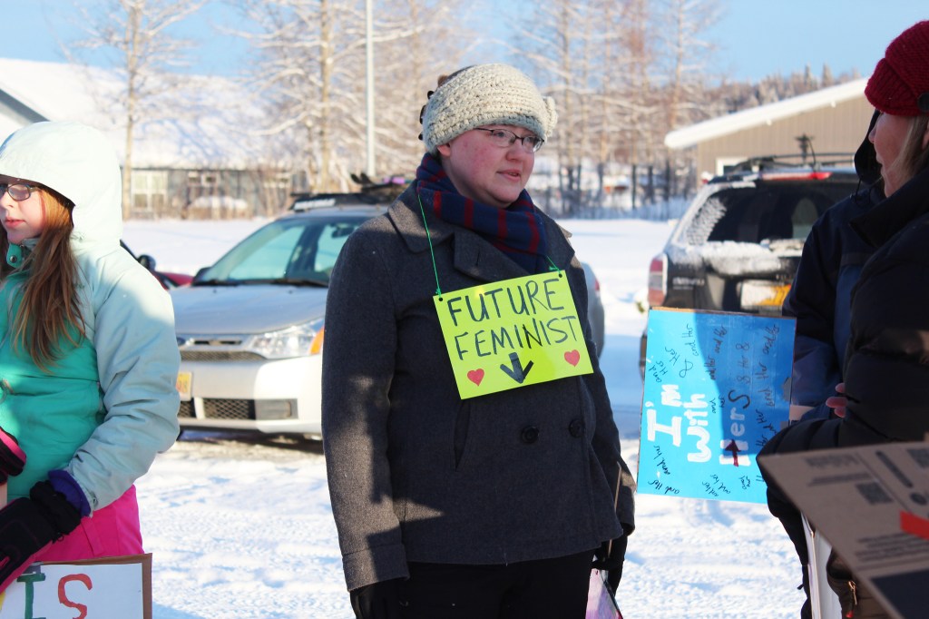 Soldotna resident Larissa Arbelovsky walks down Binkley Street in Soldotna with her 7-year-old niece, Ryan Queen, during a Women's March held Saturday, Jan. 21, 2017 in Soldotna, Alaska. Marchers held signs advocating for a number of issues, from women's reproductive rights to clean water. (Megan Pacer/Peninsula Clarion)