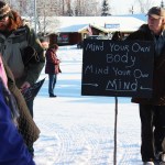 Carroll Knutson of Soldotna queues up behind a crowd of people just before taking off in a Women's March held Saturday, Jan. 21, 2017 in Soldotna, Alaska. Organizers said the march was a demonstration meant to bring area residents together to voice what they would like to see in their communities, whether it related to women's right or myriad other issues. (Megan Pacer/Peninsula Clarion)