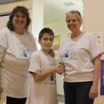 Ms. Baktuit & Terri Diamond congratulate Logan Cotton SMORES champion.