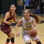 Homer senior Aurora Waclawski dribbles around Mt. Edgecumbe defender Julie Amaktoolik in Friday's Class 3A girls state semifinal at the Alaska Airlines